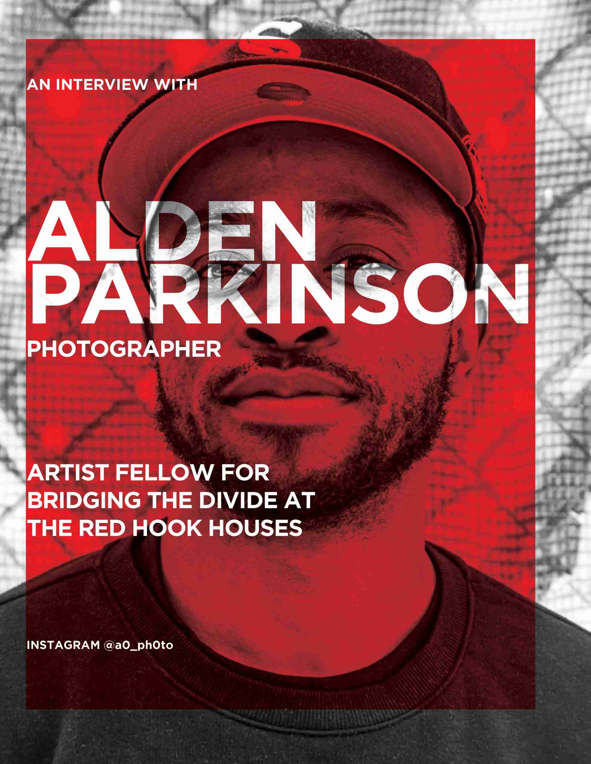 Alden Parkinson in front of one of his photos in Red Hook, Brooklyn. Photo by Pascal DuBois