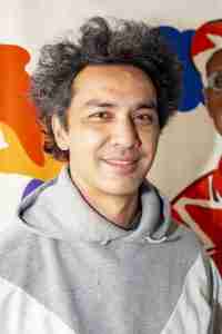 Hisham smiling